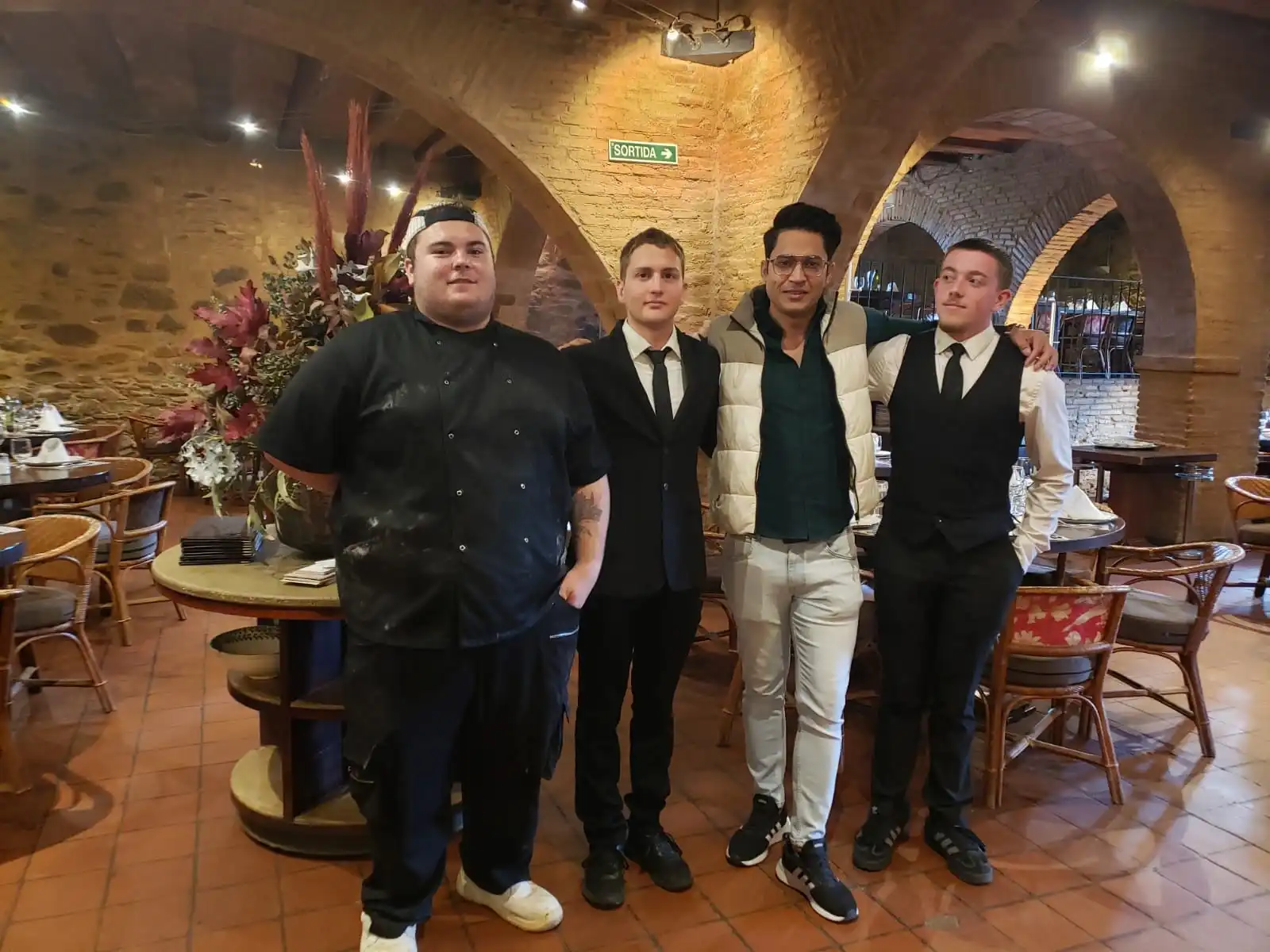 Trainees posing in the restaurant in Barcelona, where they are doing their internship.